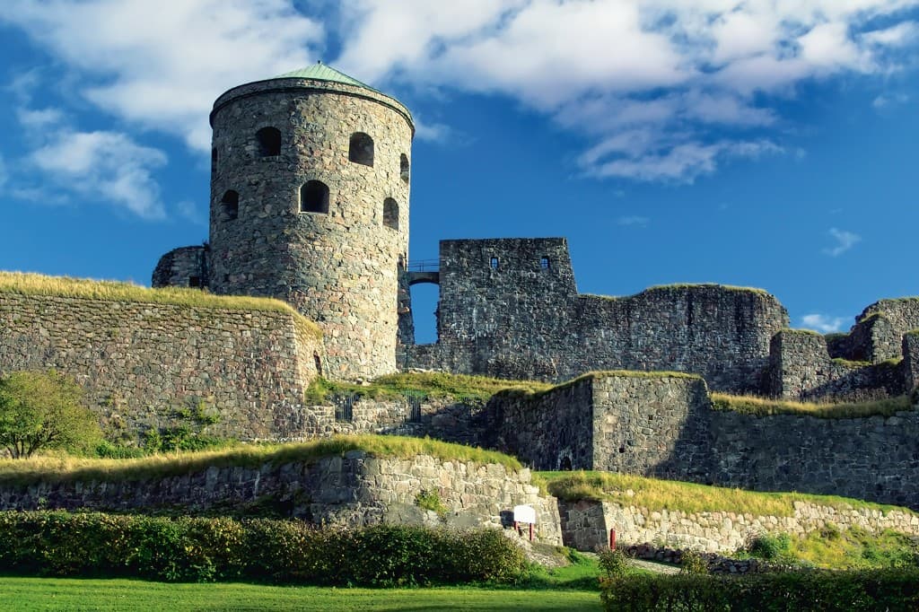 Bohus Fortress in Kungälv — the round tower (Fars hatt) and medieval stone ramparts above the Göta River.